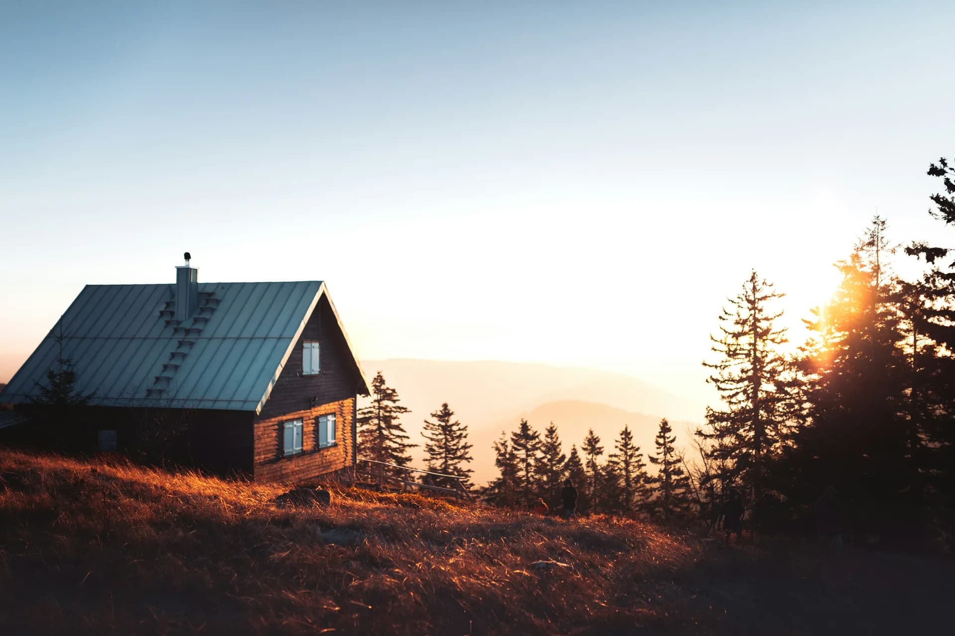 A Chalk Ridge-built standing seam roof catching the last light over the ridge